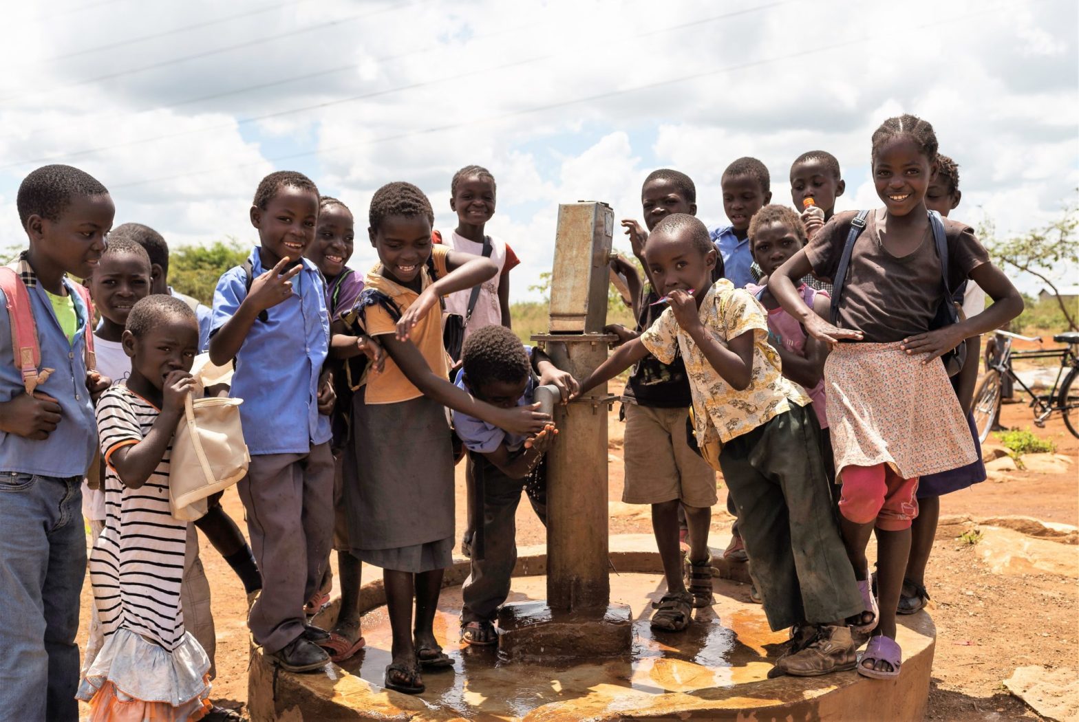 Children at water pump at Chitukuko