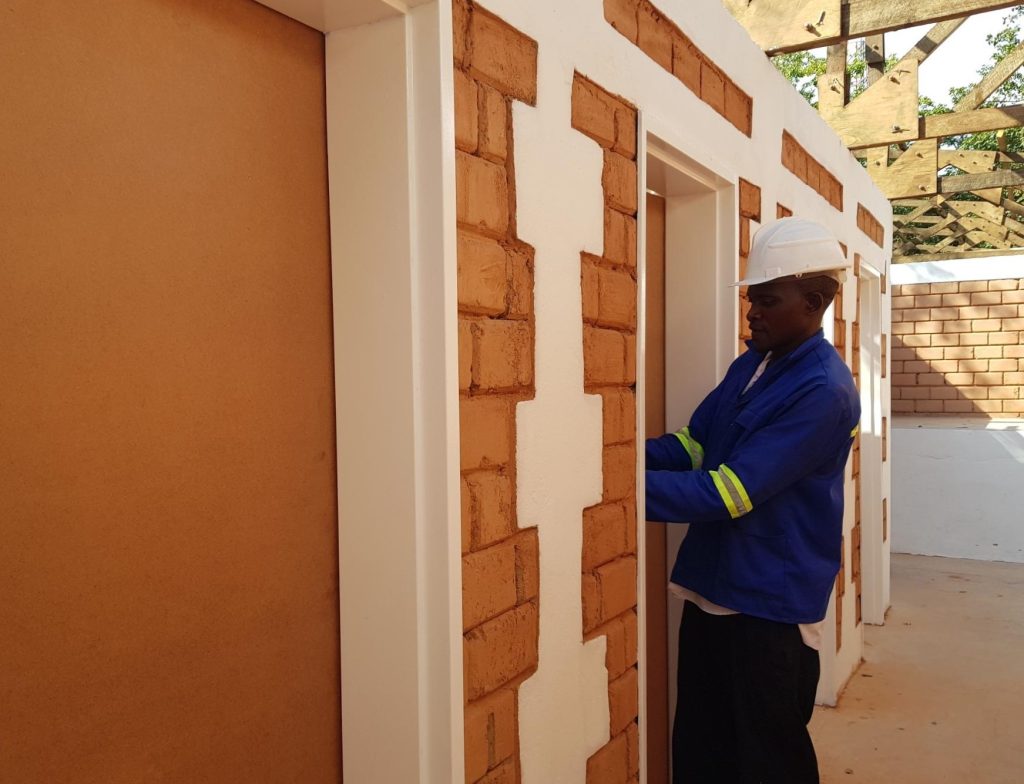 Installation of doors in the student toilet block at the Centre for Excellence