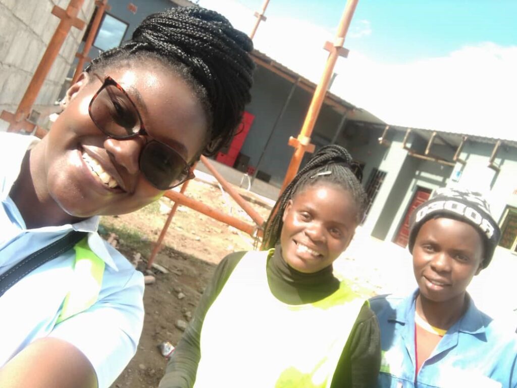 Mildred pictured with Build It graduates Memory and Winess