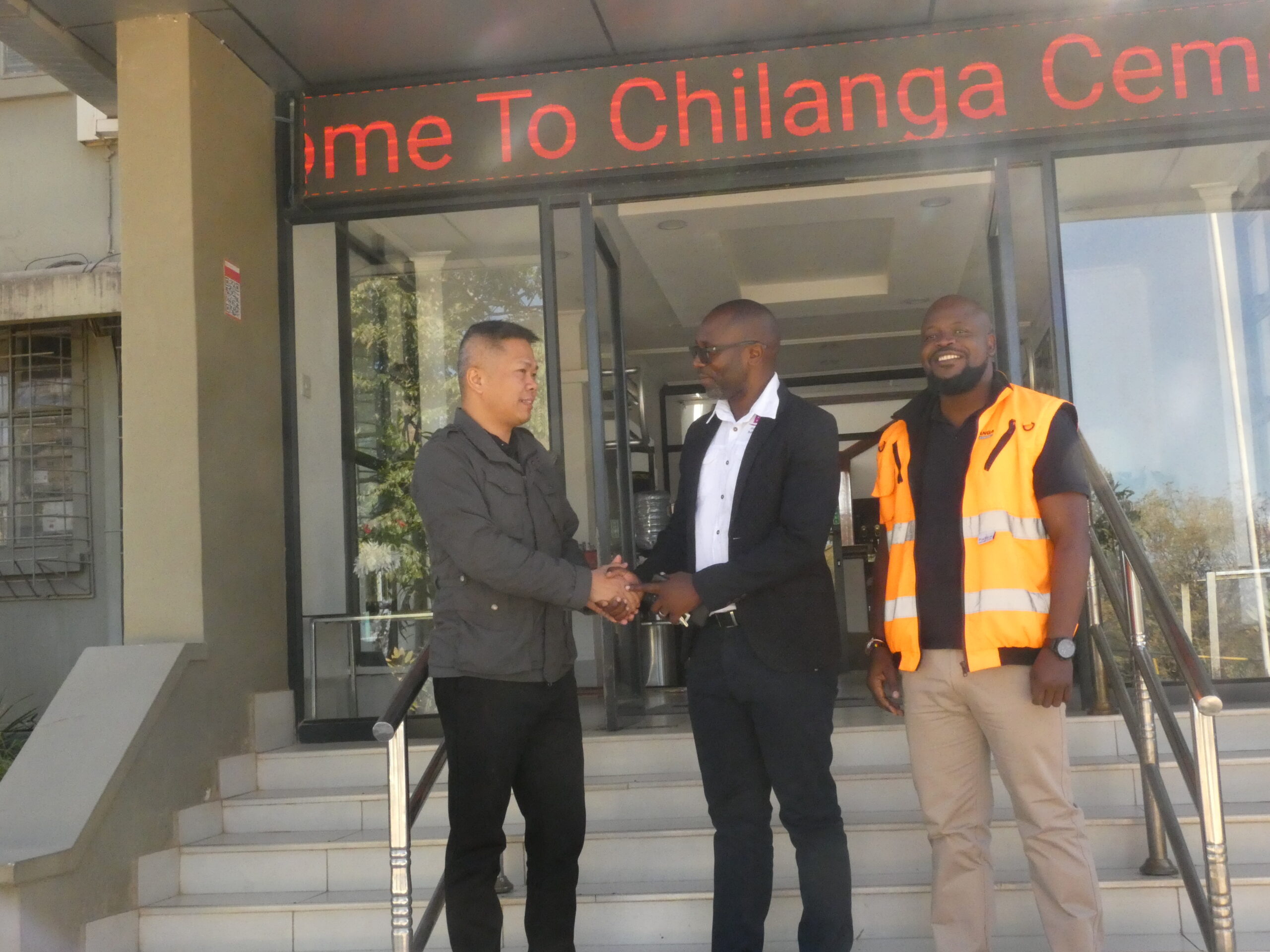 Huang Furu (Head of Procurement, Chilanga Cement Plc), Clayton Kachamba (Build It, Business Development Manager) and Gift Danga (Cooperate Affairs & Communications Manager, Chilanga Cement Plc)